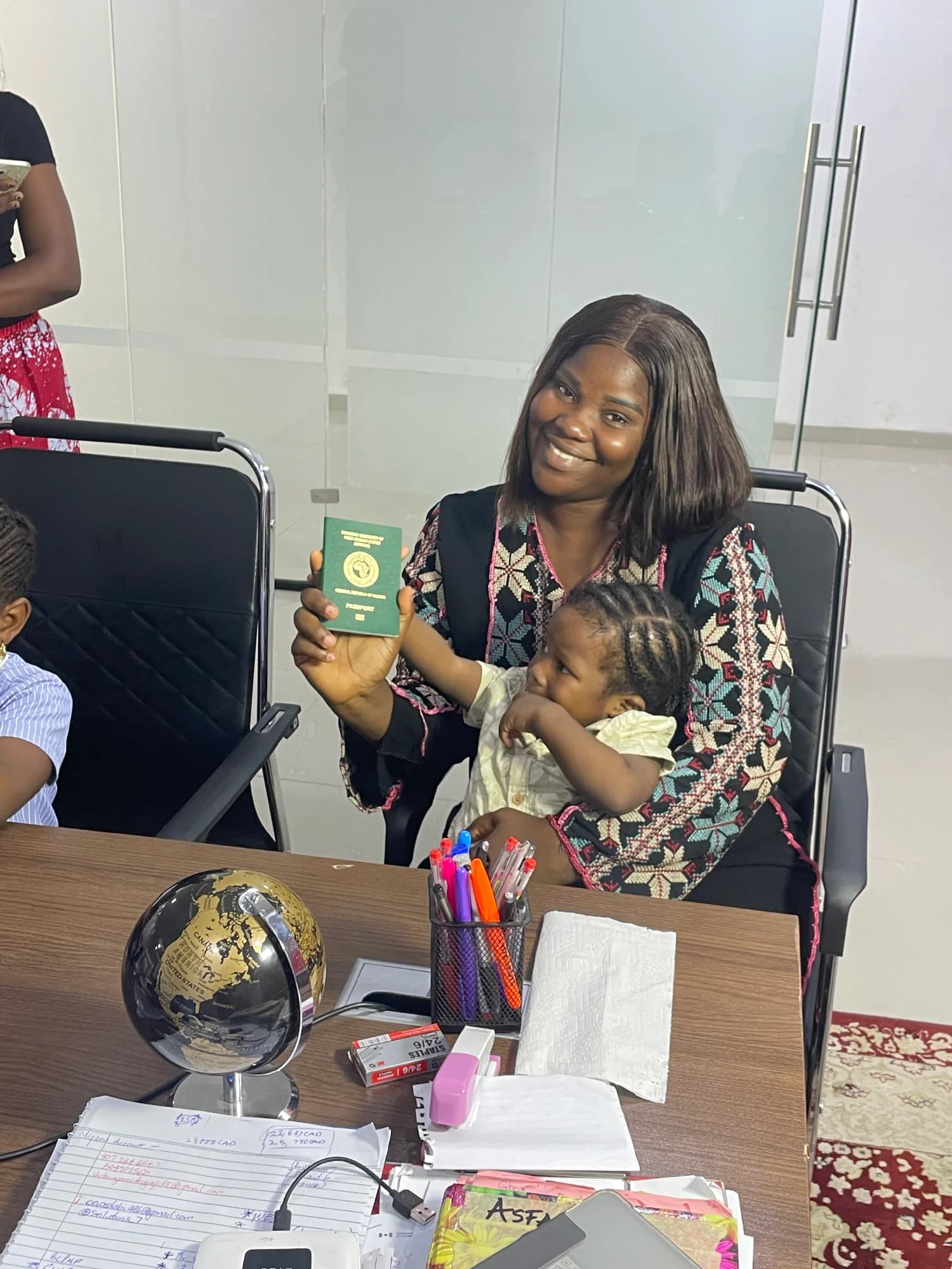 A smiling client seated at a consultation desk