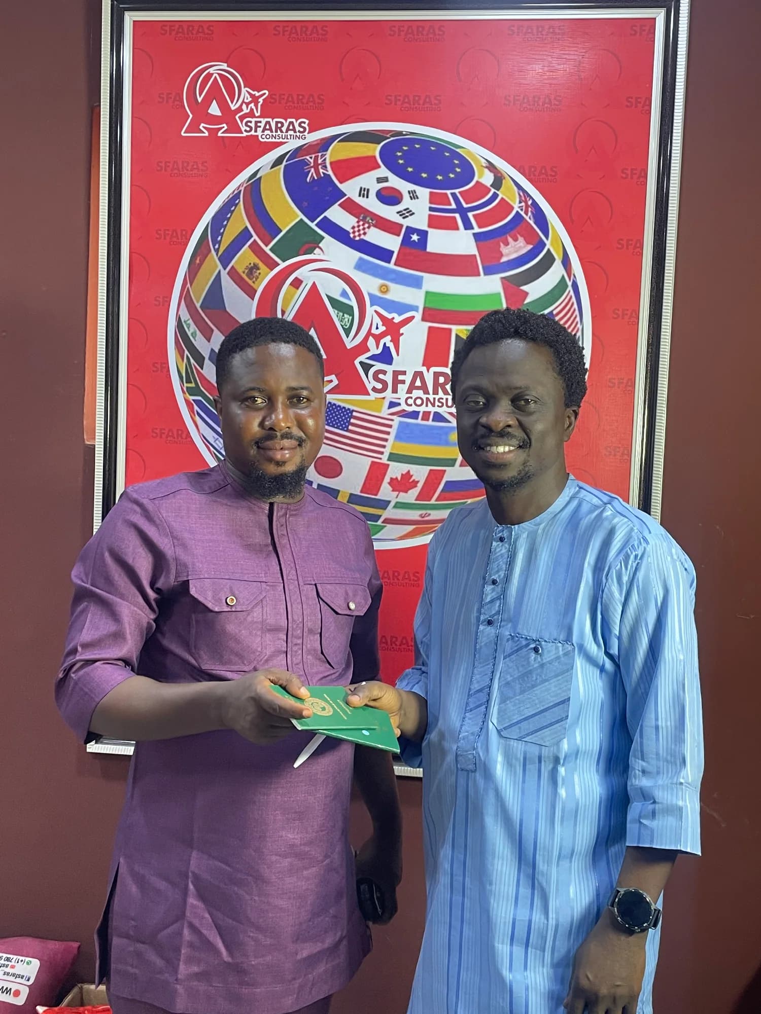 A client and consultant standing beside an Asfaras banner