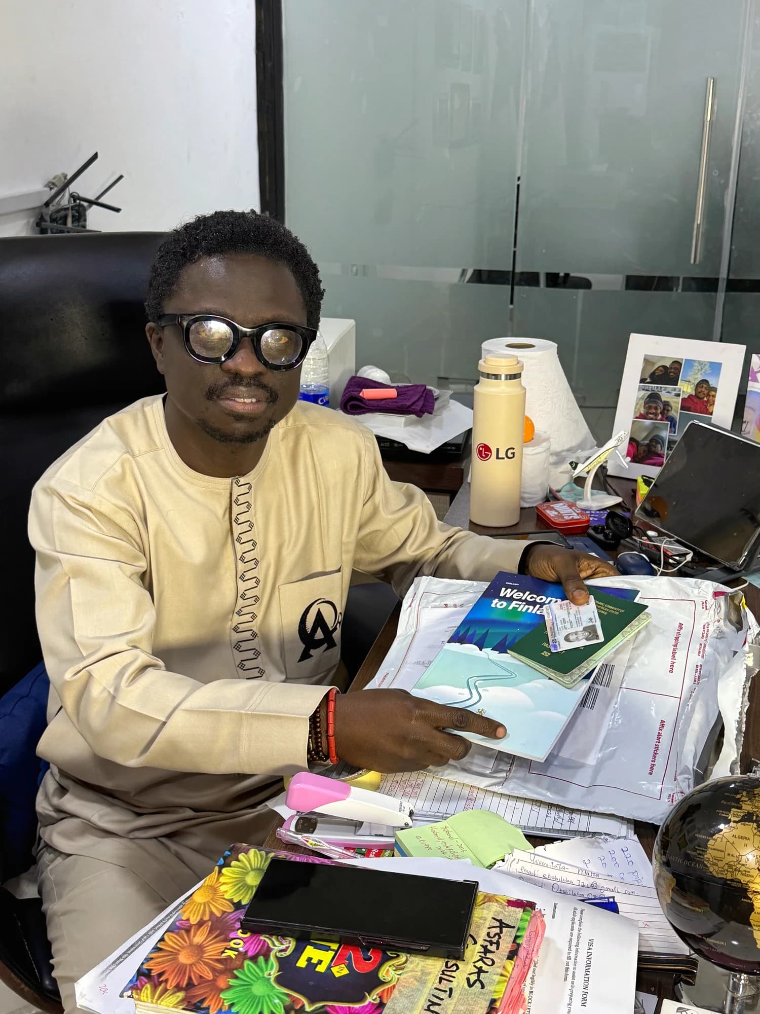 The managing director seated at his office desk