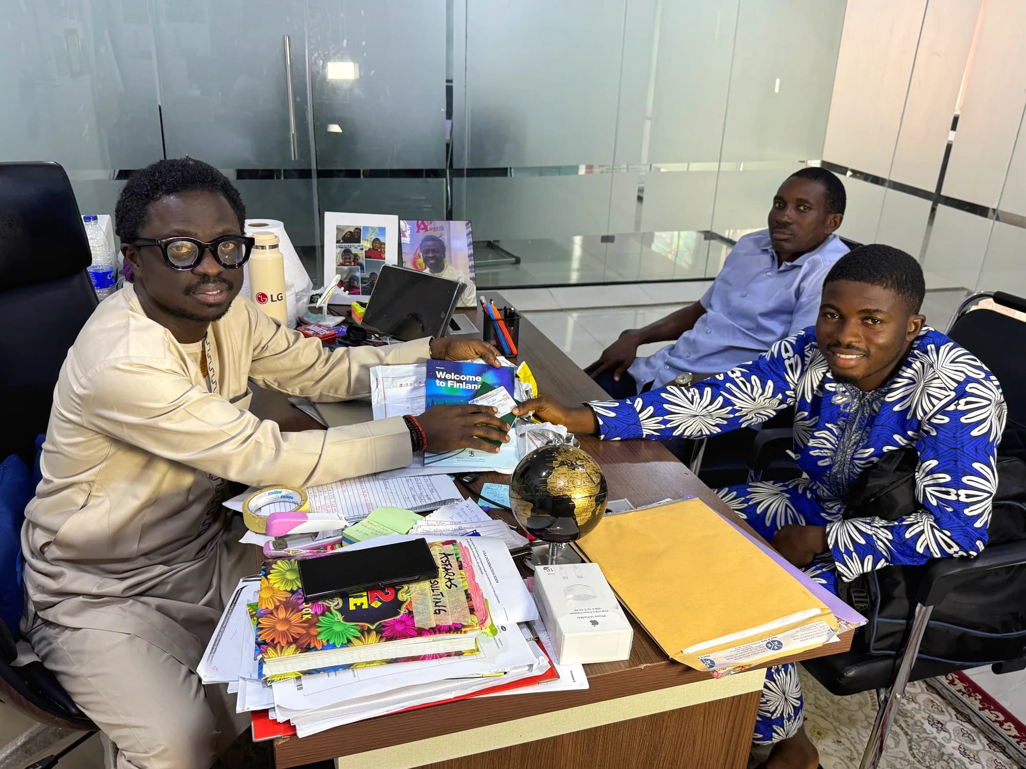 A consultation meeting around an office desk