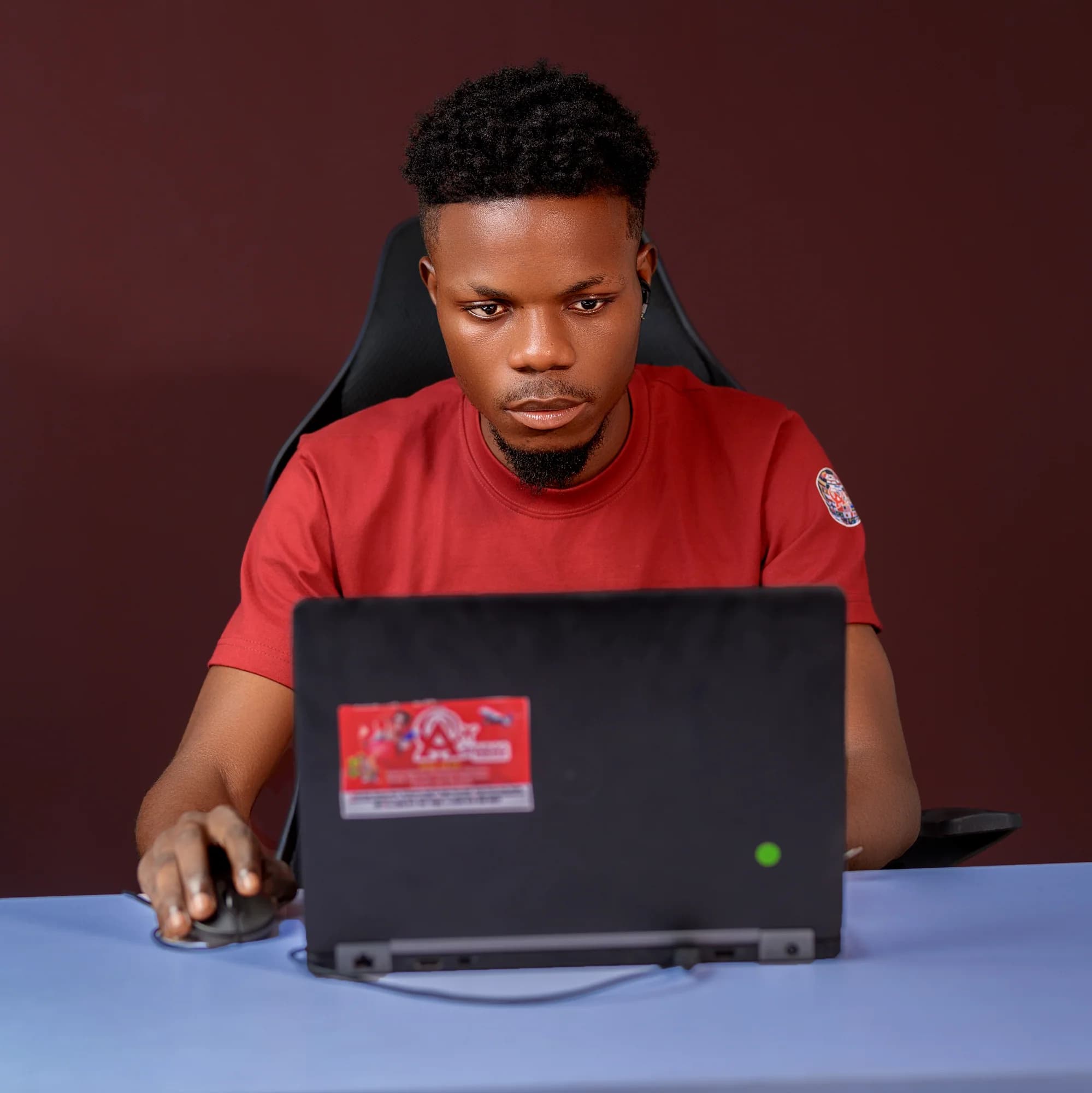 An Asfaras team member working on a laptop