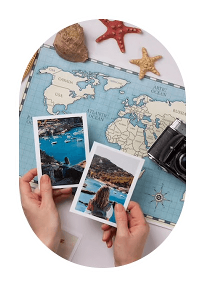 Travel photographs arranged over a world map